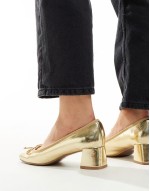 Wide Fit Steffie bow detail mid block heeled shoes in gold